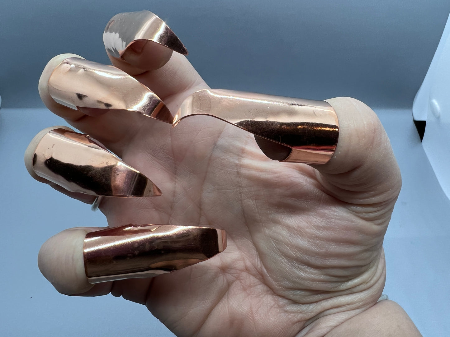 Plain (no texture) shiny copper claws, set of five.