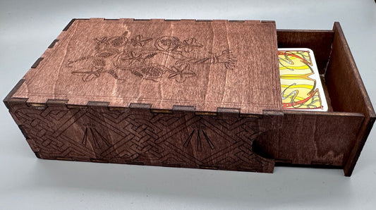 Top view of wood Tarot box with vines, leaves, grapes on the top and celtic knots with Ahwen symbol on the side.