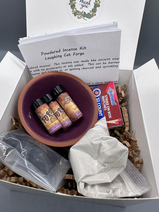 Boxed incense kit photo showing off bowl, vials of incense, matches, charcoal, ash and instructions