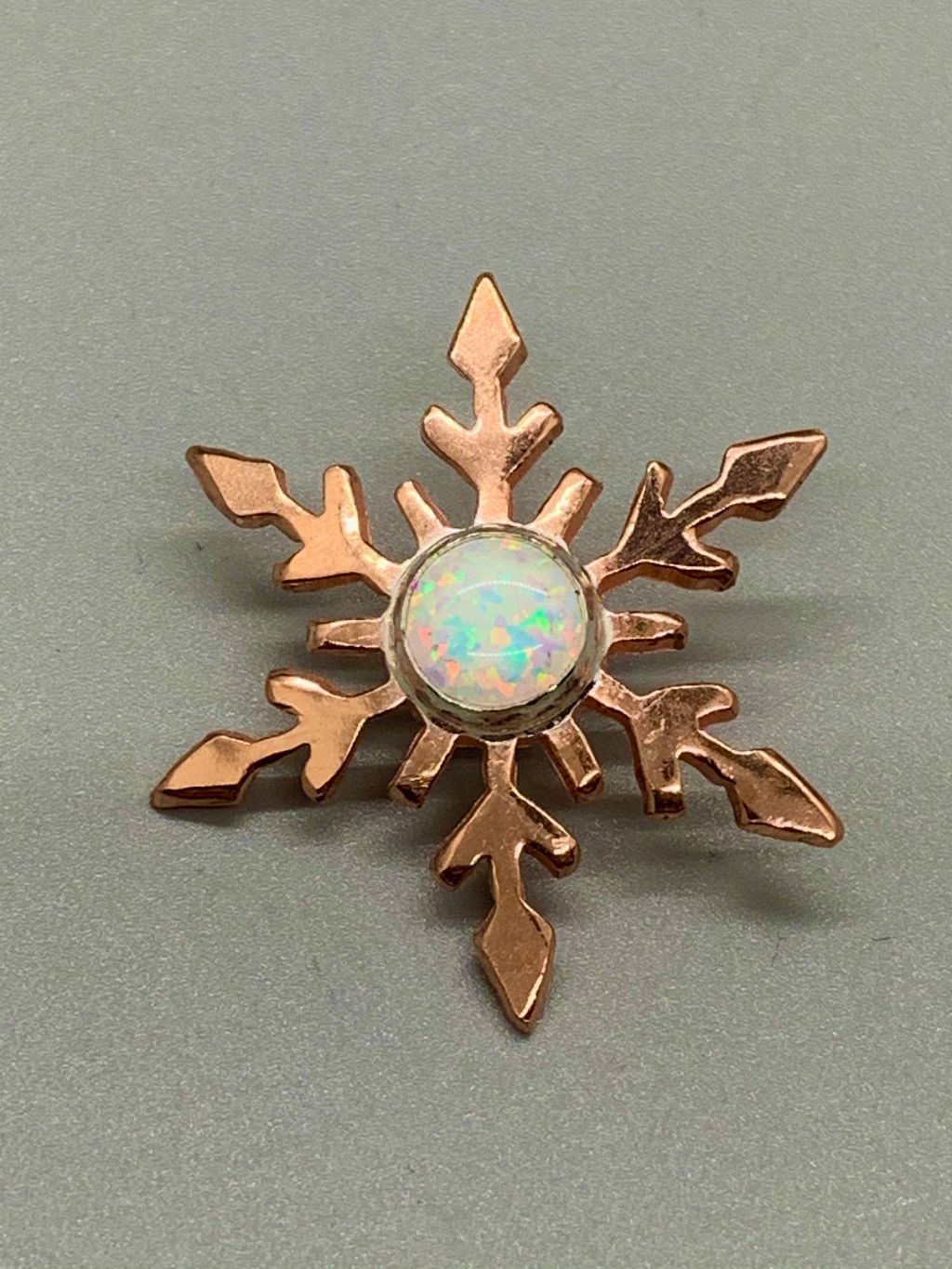 Sawcut copper snowflake with bezel set opal