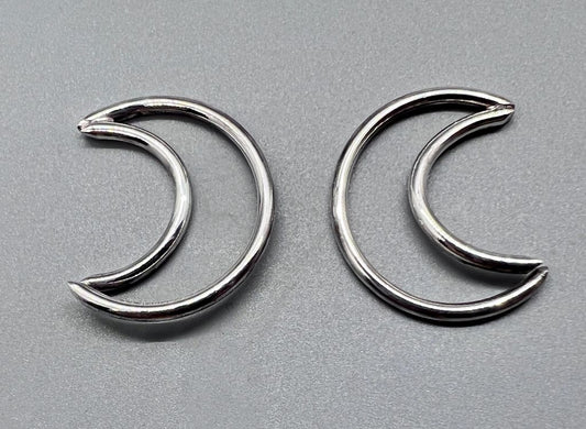 Sterling silver crescents with one end open for piercings.