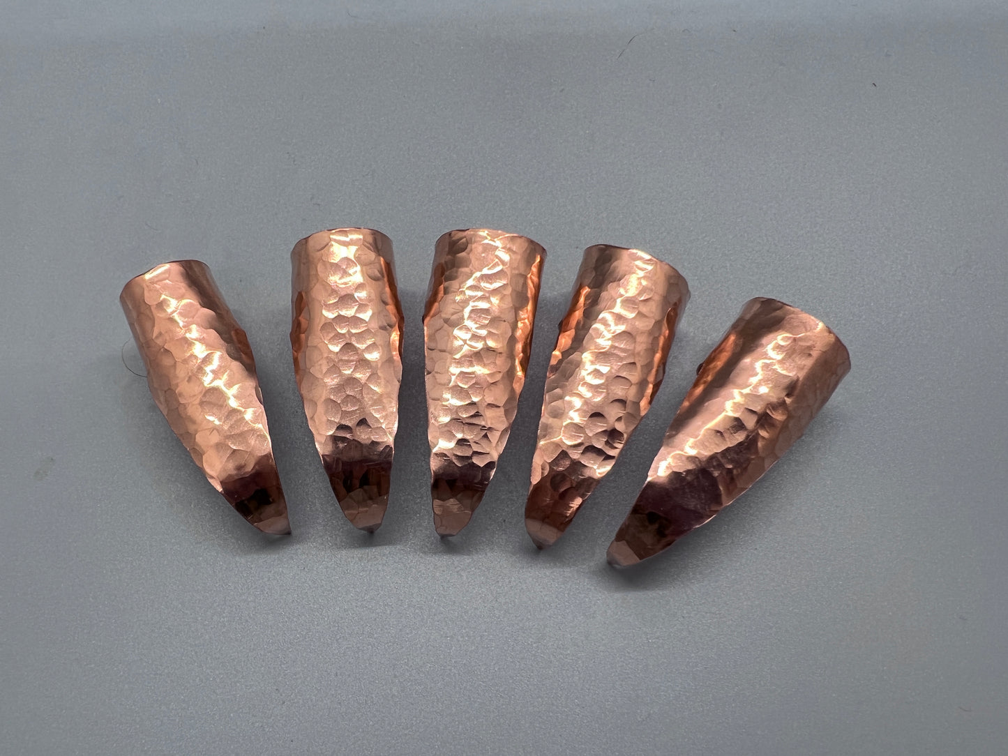 Hammered copper claws, no patina, set of five.