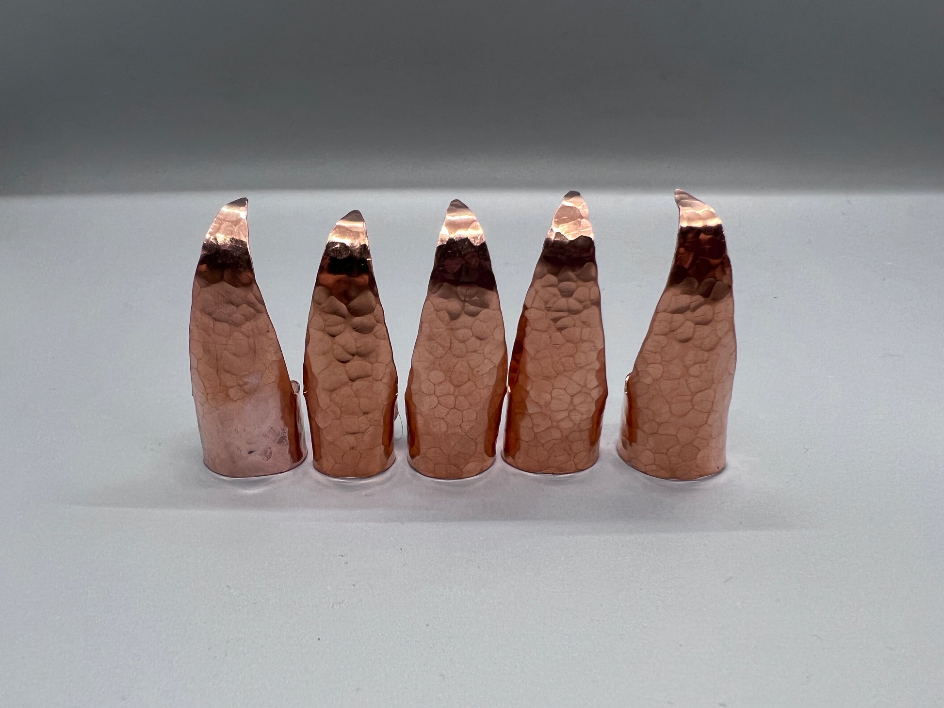 Hammered copper claws, no patina, set of five.