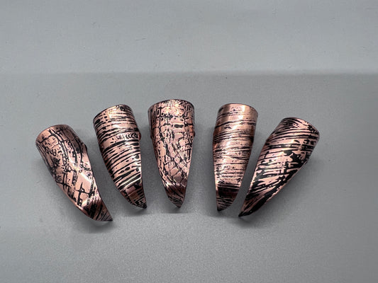 Copper claws embossed with woodgrain and patina'd, set of five.