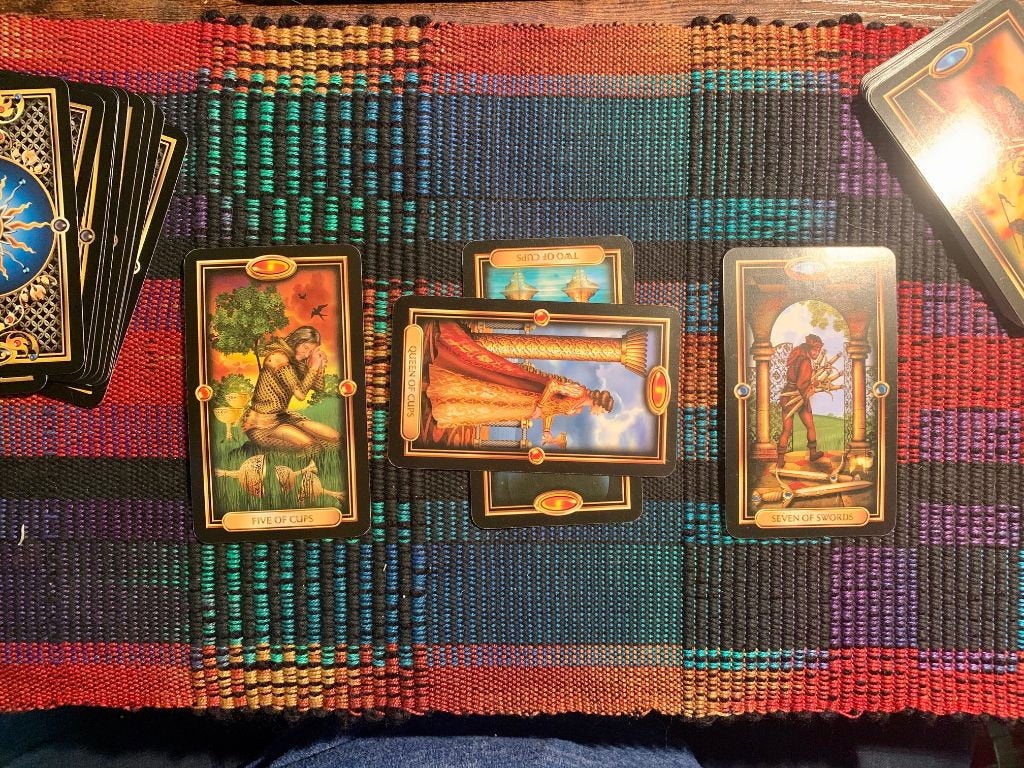 Stock photo of tarot cards laid out on a tarot cloth.